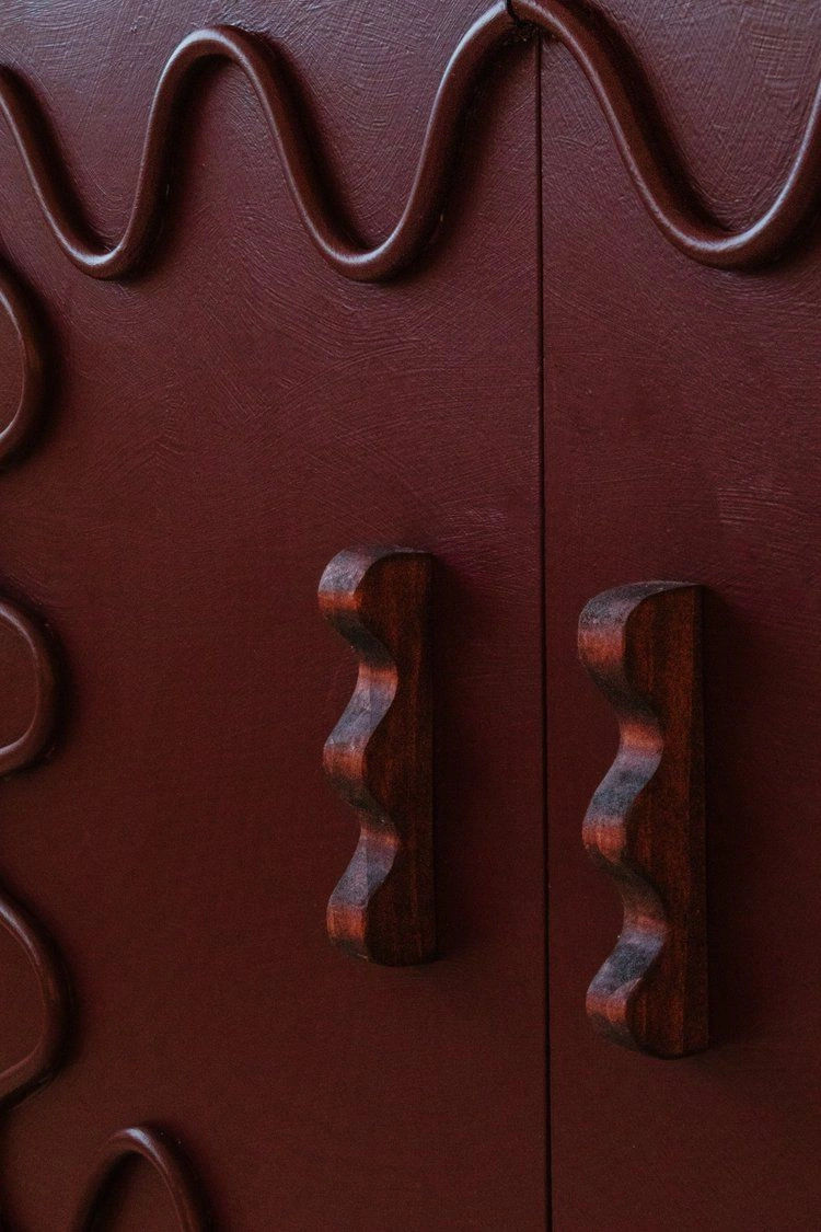 Athar sculptural knobs on a red door