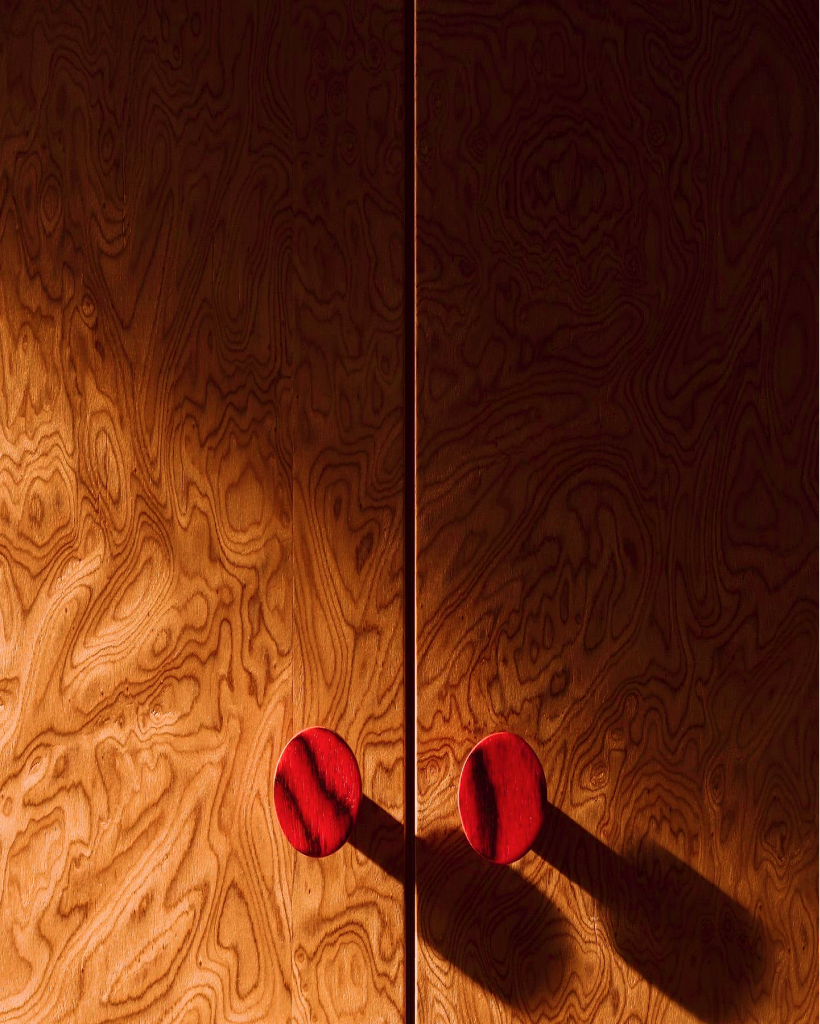 Athar wooden doors with sculptural knobs