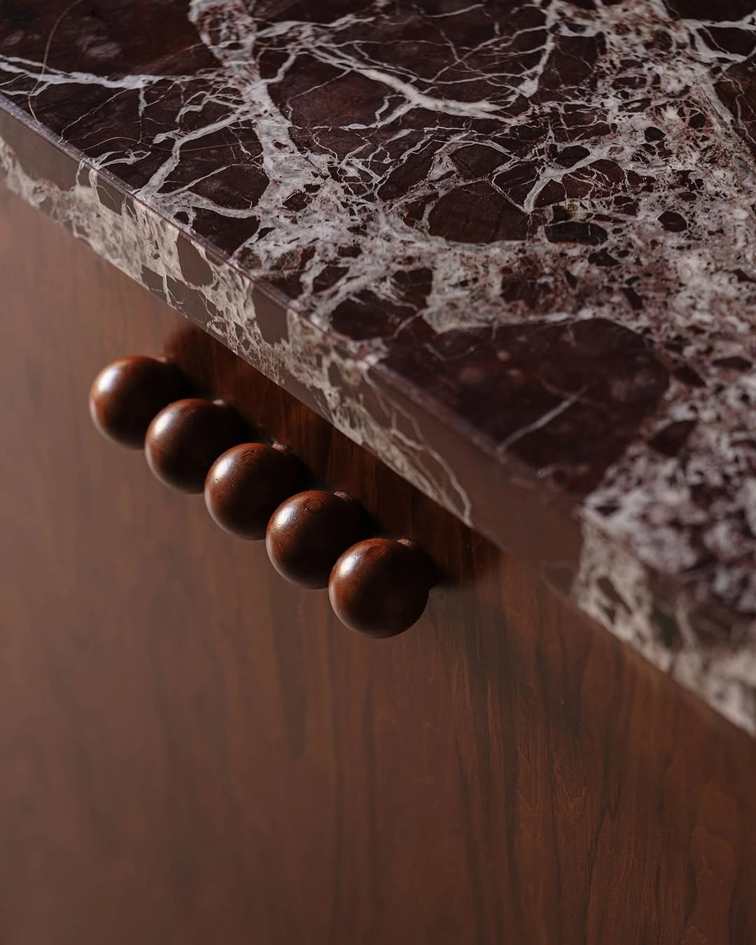 Athar round wooden knobs on marble
