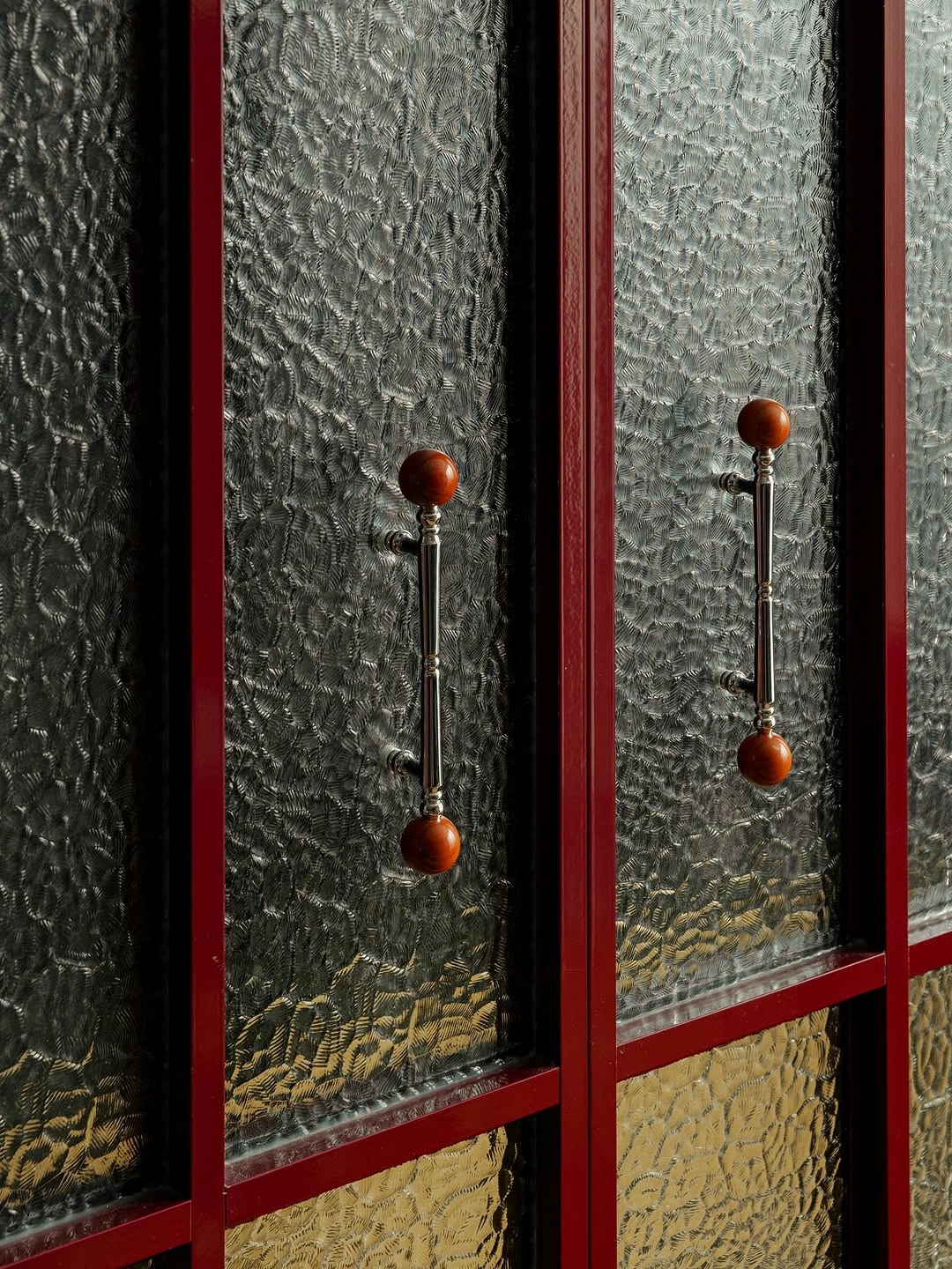 Athar knobs on textured glass doors